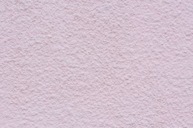 Açık pembe bir beton duvarın dokusu. Soyut mimari arka plan. harici alçı.