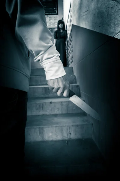 Serial killer with knife and woman in background,Scary background for book cover ideas — Stock Photo, Image