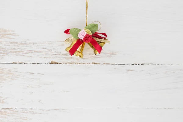 Campanas de Navidad en pisos de madera — Foto de Stock