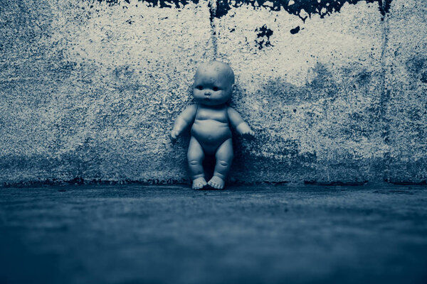Spooky doll in haunted house