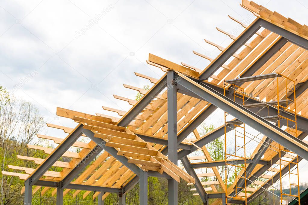 Steel frame with wooden beams construction.