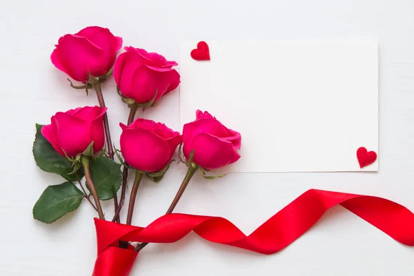 Flower composition with rose bouquet and hearts with copy space — Stock Photo, Image