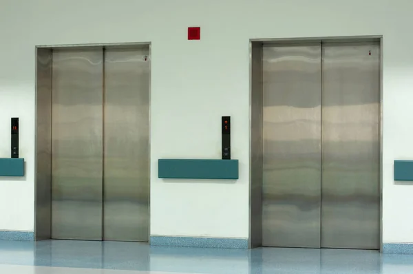 Side View of Two Doors in Elevator with Closed Doors
