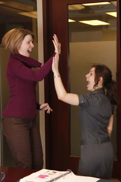 business women high five