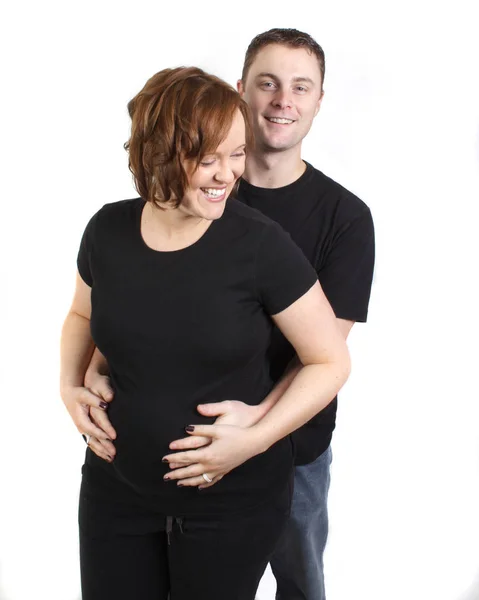 Jeune couple attendant bébé rire et sourire — Photo