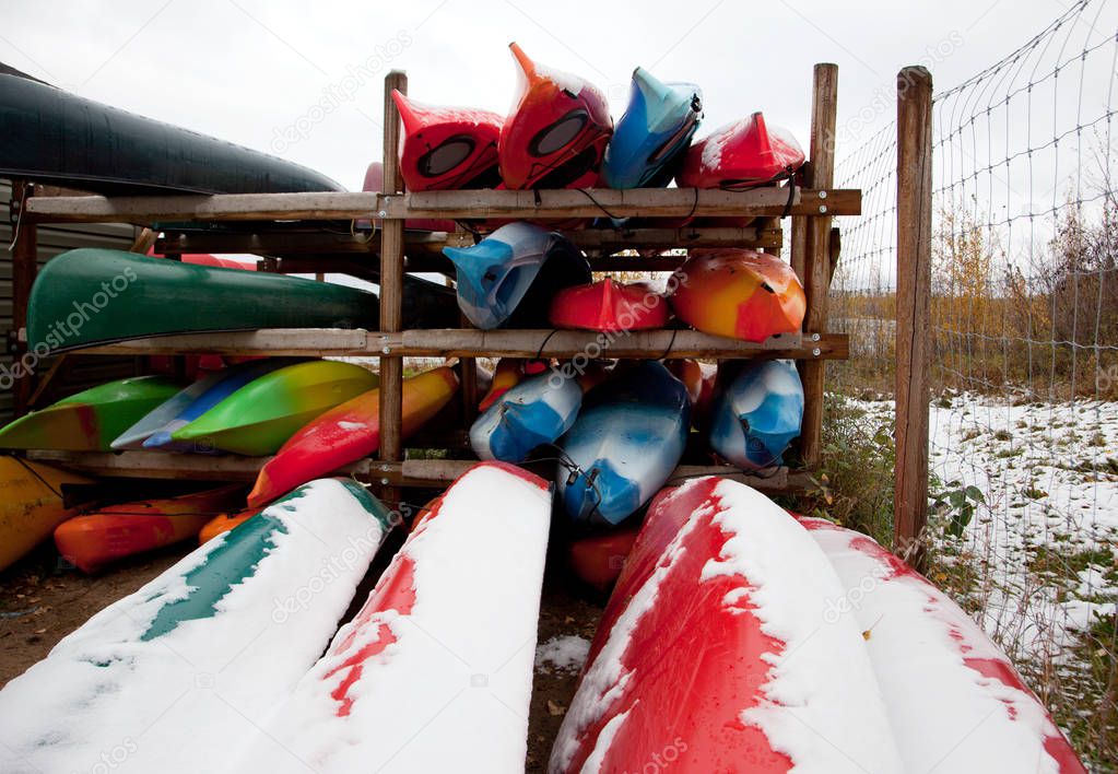 kayaks covered in snow 