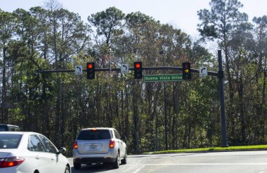 February 23, 2020 - Orlando, Florida: Red stop light at Buena Vista Drive on Disney property