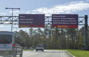 February 23, 2020- Orlando Florida: Signs indicating which lane to drive for Epcot, Magic Kingdom and more 