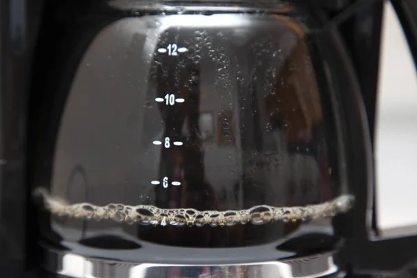 glass coffee drip maker bubbling in the kitchen ready for drinking