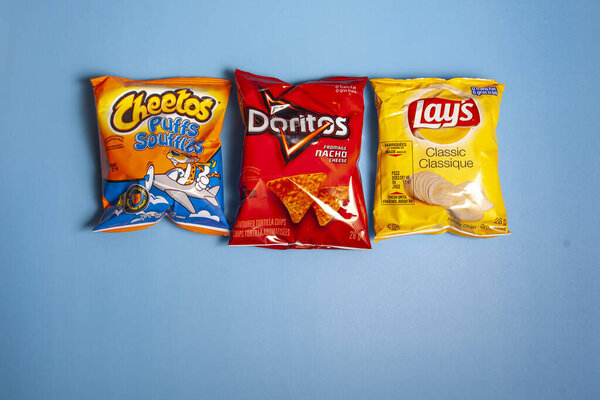 Halifax, Canada- April 11, 2020: Small bags of Cheetos, Lays and Doritos brand chips