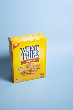 Halifax, Canada - April 11, 2020: A yellow box of Wheat Thins brand crackers  clipart