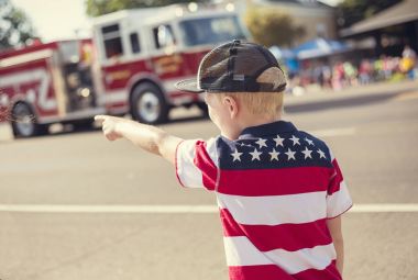Boy watching an Independence Day Parade clipart