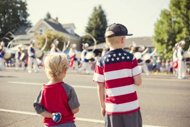 Kids watching an Independence Day Parade clipart