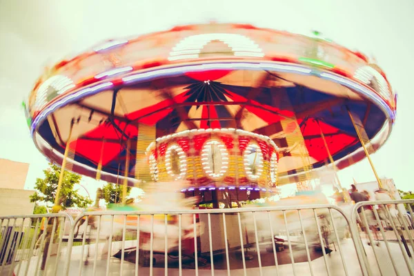 Merry-Go-Round in motion spinning around — Stock Photo, Image