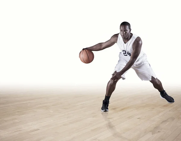 Player  dribbling up the court. — Stock Photo, Image