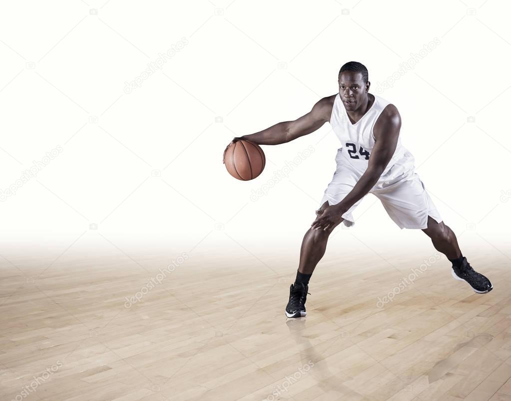  player  dribbling up the court.