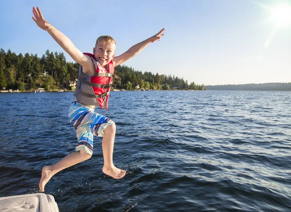 Boy Jumping Beautiful Mountain Lake Having Fun Summer Vacation Having — Stock Photo, Image
