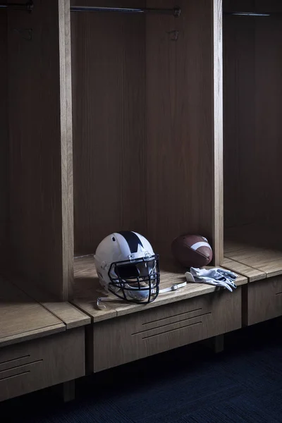Football Helmet Sitting Locker Room Sports Stadium Spotlight Showing Individual — Stock Photo, Image