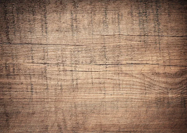 Dark brown scratched wooden cutting board. Wood texture — Stock Photo, Image