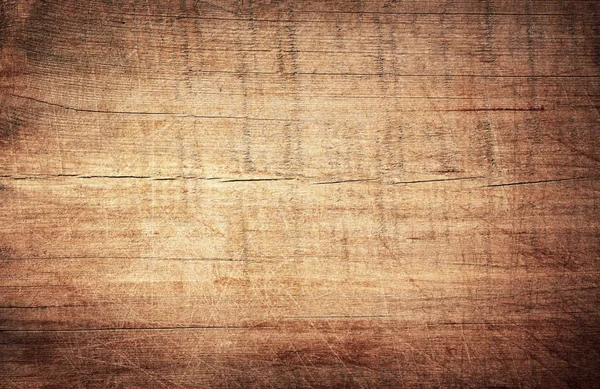 Brown arranhado placa de corte de madeira. Textura de madeira — Fotografia de Stock