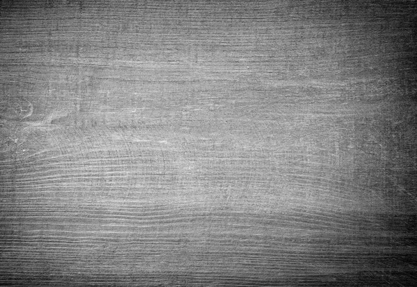 Black scratched wooden cutting board. — Stock Photo, Image