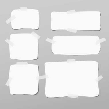 Dikkat, defter, boşaltmak kağıt, gri arka plan üzerinde beyaz yapışkan bant ile sıkışmış.