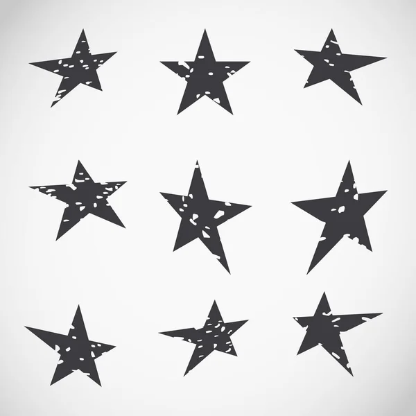 Cracked black grunge stars collection on vignette. — Stock Vector