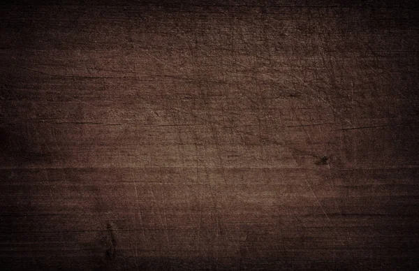 Dunkelbraun zerkratzt Holzschnitt, Schneidebrett. Holzstruktur — Stockfoto