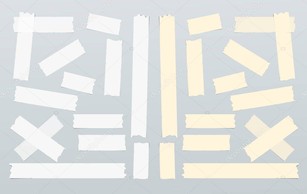 Brown and white adhesive, sticky, masking, duct tape, paper strips, pieces for text on gray background