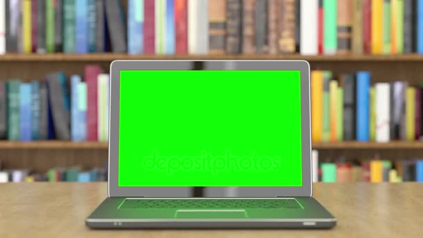 Zelená obrazovka notebooku v knihovně — Stock video