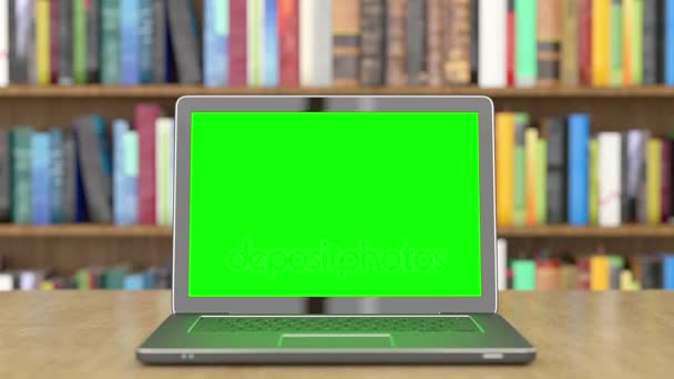 Laptop de tela verde na biblioteca — Vídeo de Stock