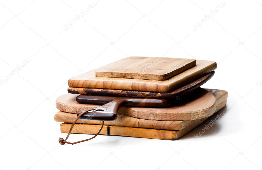 Stack  of used cutting boards isolated on white 