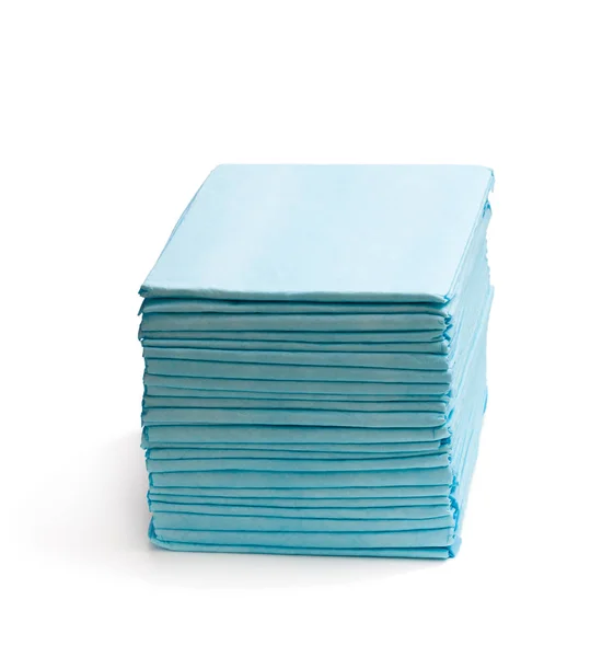 Stack  of disposable bed pads isolated on white — Stock Photo, Image