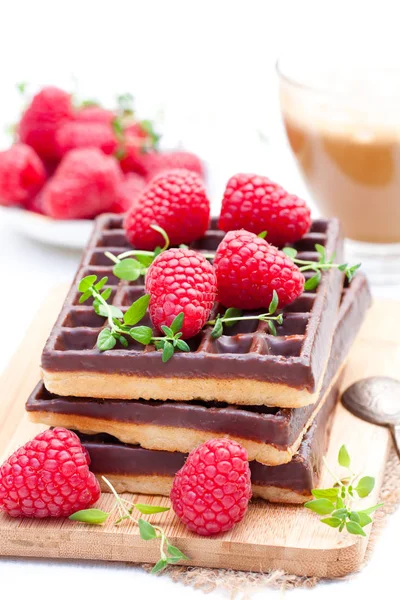 Stack  of chocolate waffles with fresh raspberry and cup of coff — Stock Photo, Image