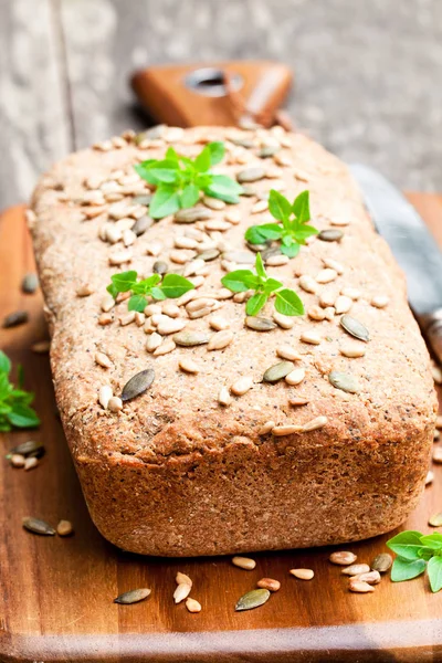 Homemade  whole rye bread with sunflower seeds and greek basil l — Stock Photo, Image