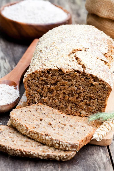 Homemade  rye bread with wholemeal bread flour on wooden table — Stock Photo, Image