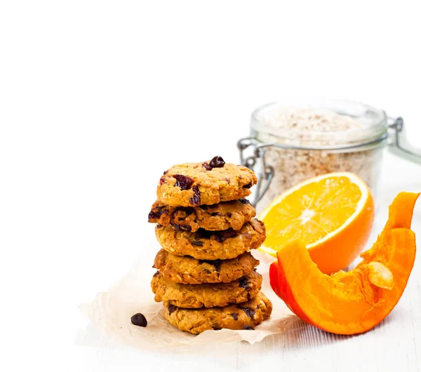 Homemade  pumpkin and orange cookies on white background