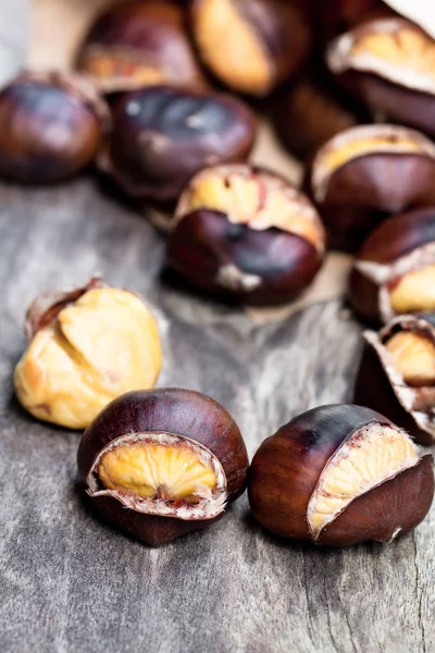 Roasted  chestnuts on wooden background — Stock Photo, Image