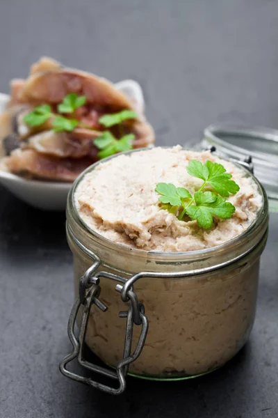 Forshmak  paste from herring on black stone background — Stock Photo, Image