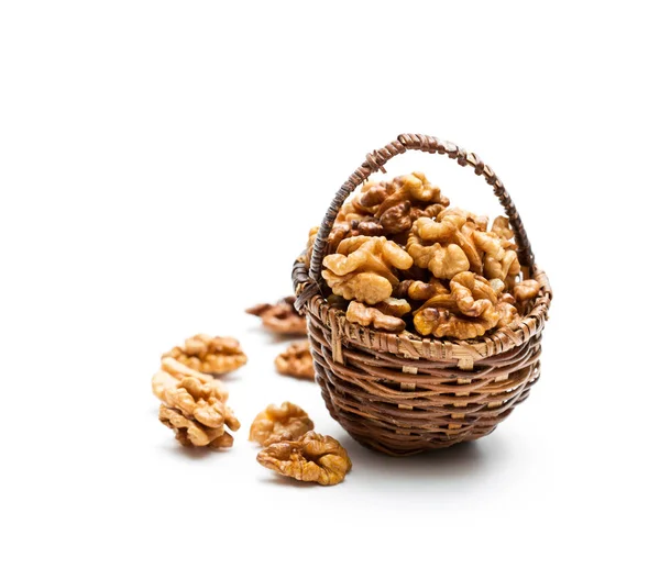 Walnut  kernels in a small wicked basket isolated on white — Stock Photo, Image