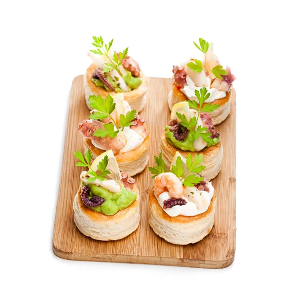 Vol-au-vents  puff pastry cases filled with salted squid and oct — Stock Photo, Image