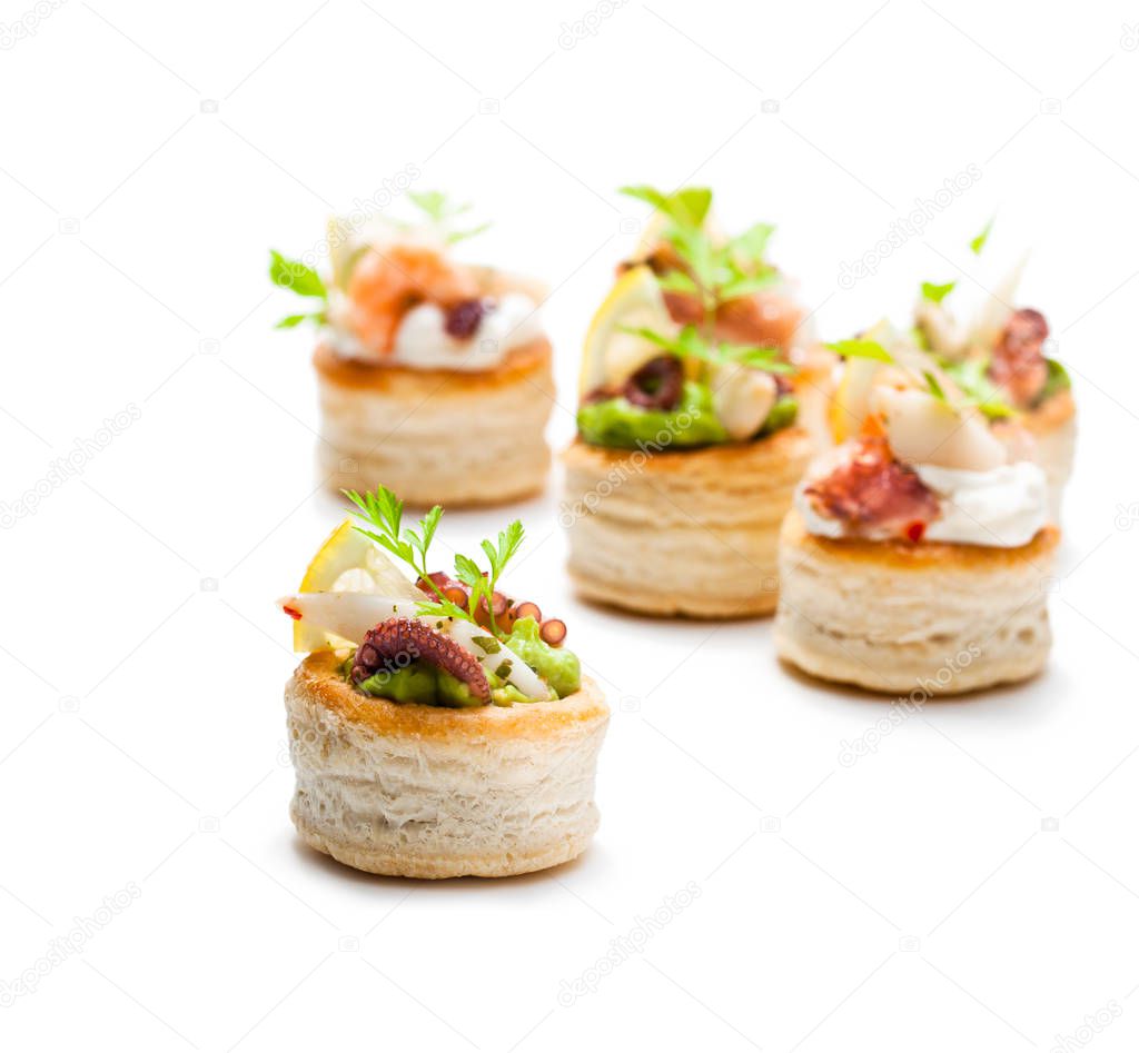 Vol-au-vents  puff pastry cases filled with salted squid and oct