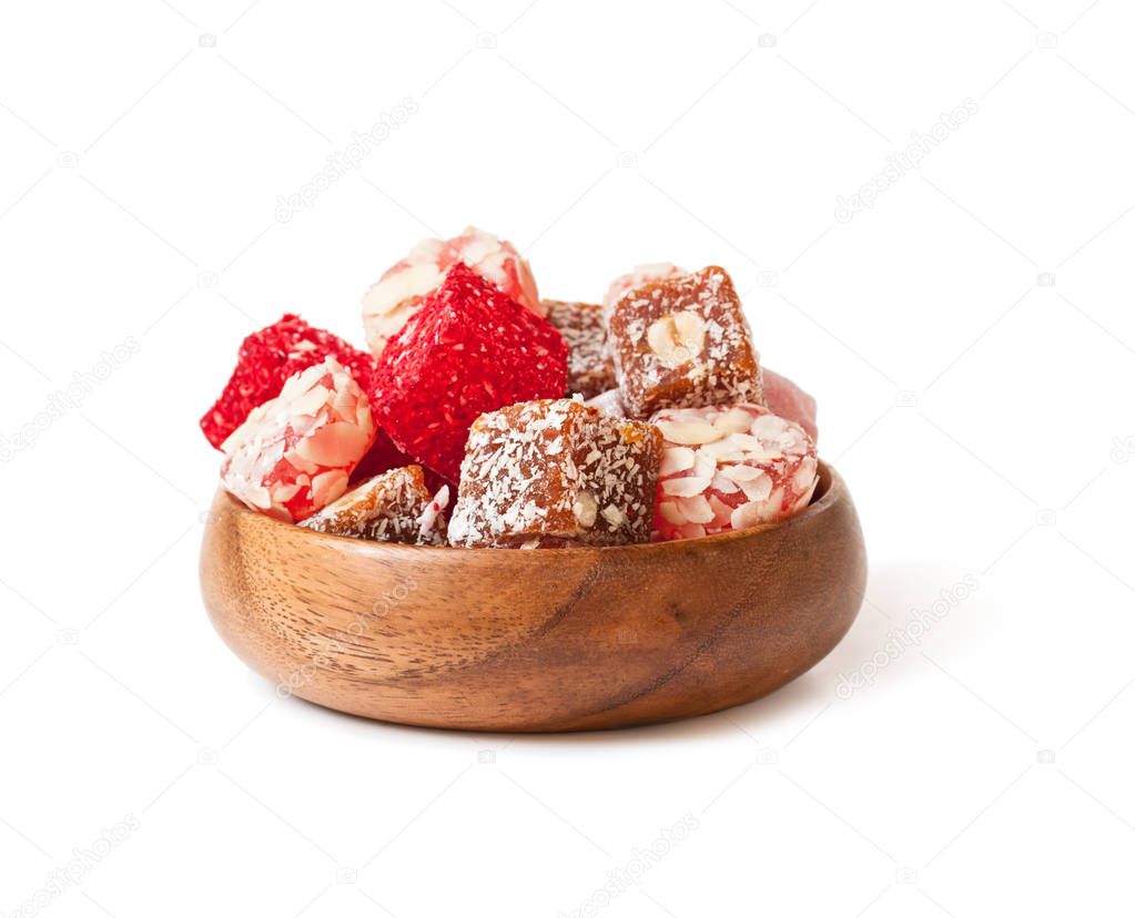 Assortment  turkish delight in wooden plate isolated on white 