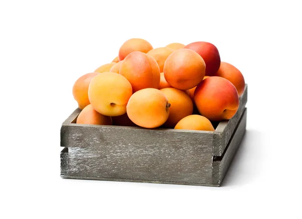 Fresh  apricots on wooden box isolated on white — Stock Photo, Image