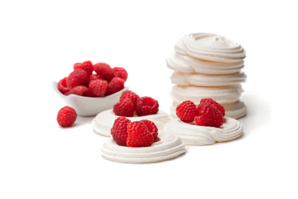 Mini  Pavlova meringue nests with raspberries on isolated on whi — Stock Photo, Image