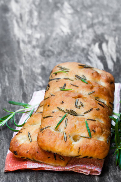 Homemade  rosemary focaccia on wooden table 
