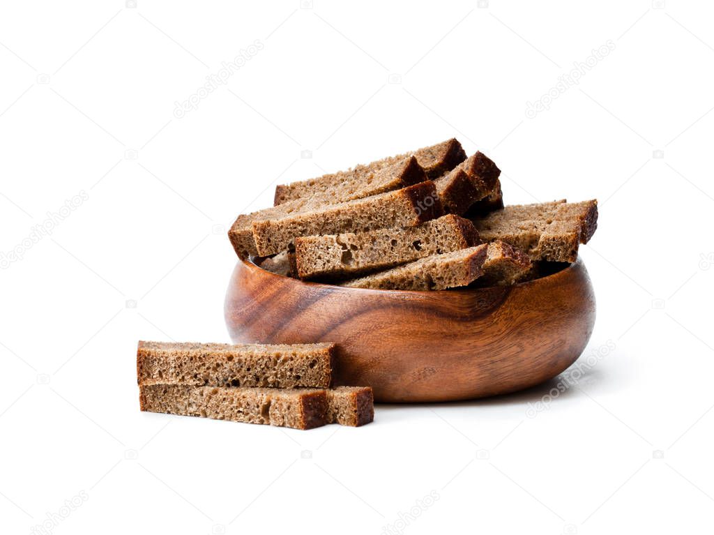 Rye  bread crackers in wooden bowl isolated on white 