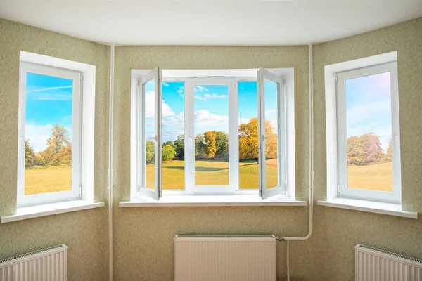 View through a opened modern PVC window onto beautiful autumn landscape — Stock Photo, Image