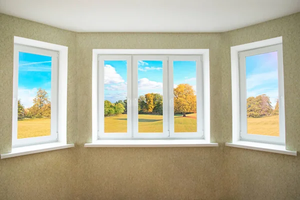 View through a modern PVC window onto beautiful autumn landscape — Stock Photo, Image