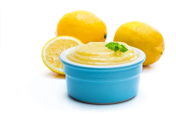 Homemade Lemon Curd in blue ceramic bowl isolated on white — Stock Photo, Image